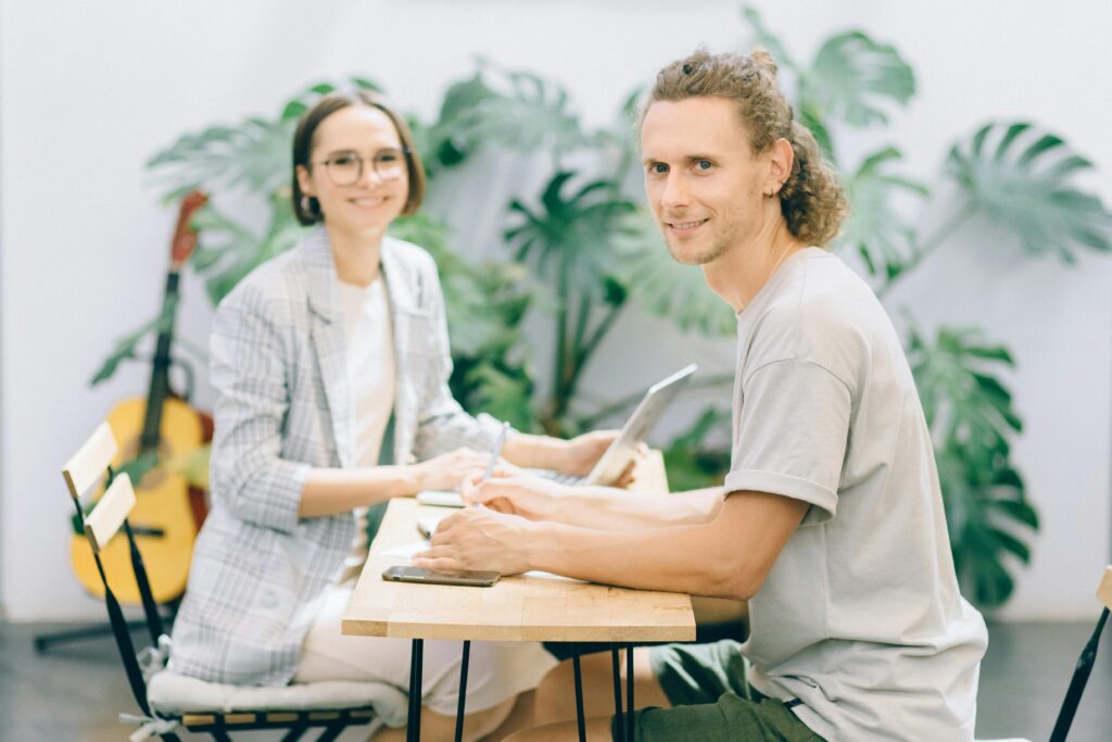 Two professionals collaborating in a stylish office setting.